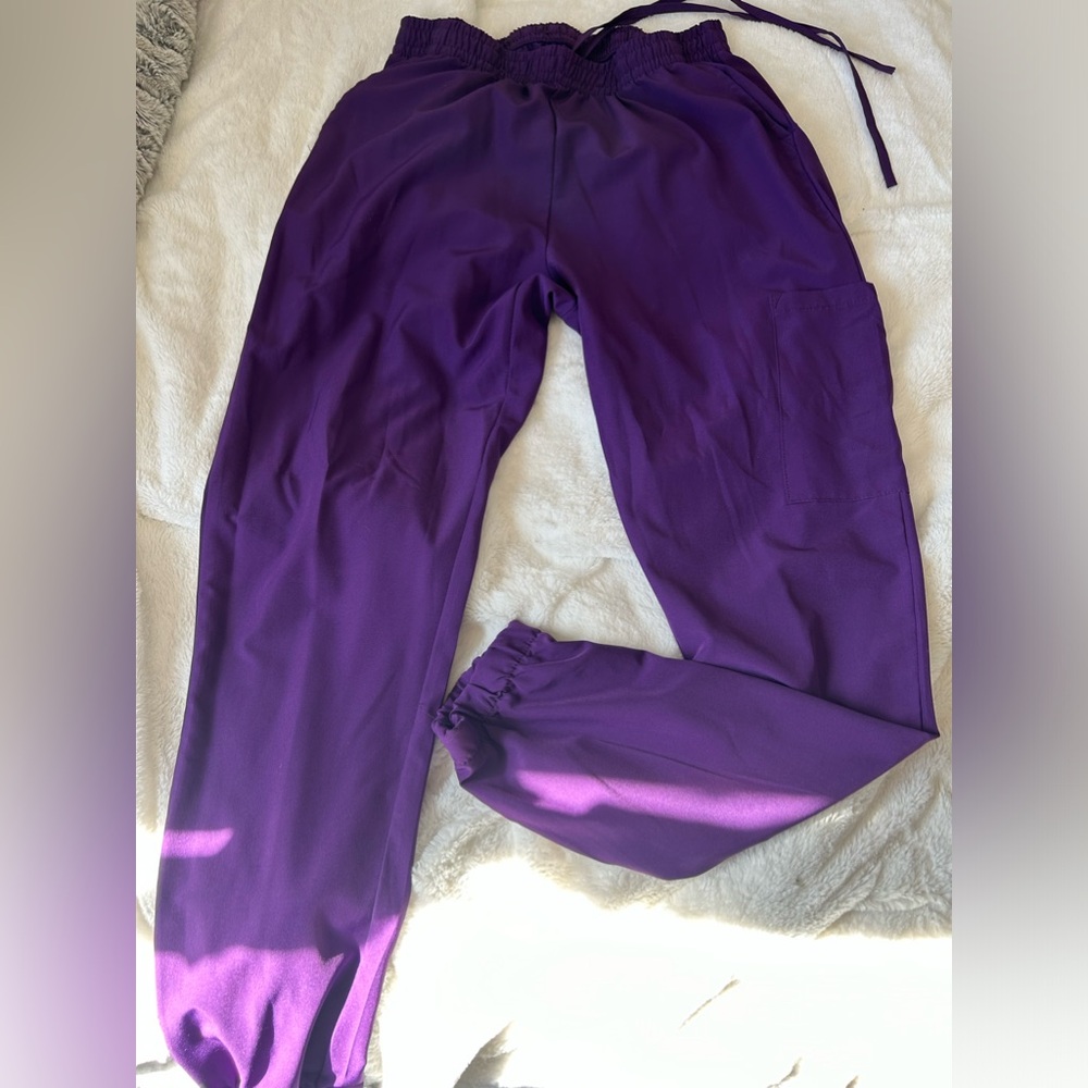 Scrubs. Purple and have matching pairs.